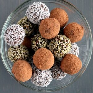 snack balls made with dates, coconut, nuts, and cacao powder