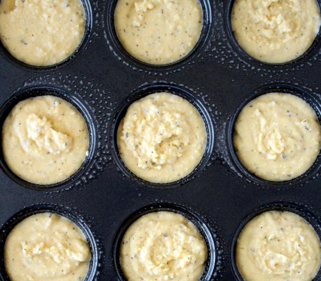 batter of the paleo dinner rolls in a muffin tin before baking.